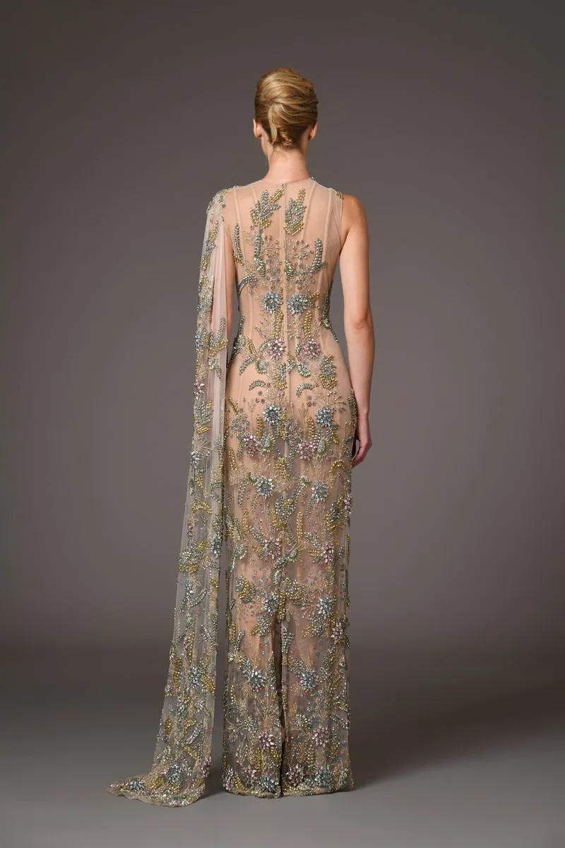 Nude silk tulle dress adorned with delicate flower embroidery and a flowing cape