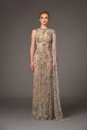 Nude silk tulle dress adorned with delicate flower embroidery and a flowing cape