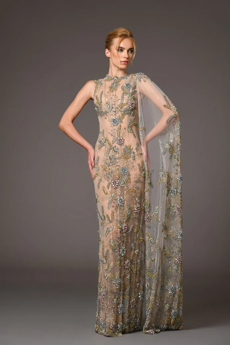 Nude silk tulle dress adorned with delicate flower embroidery and a flowing cape